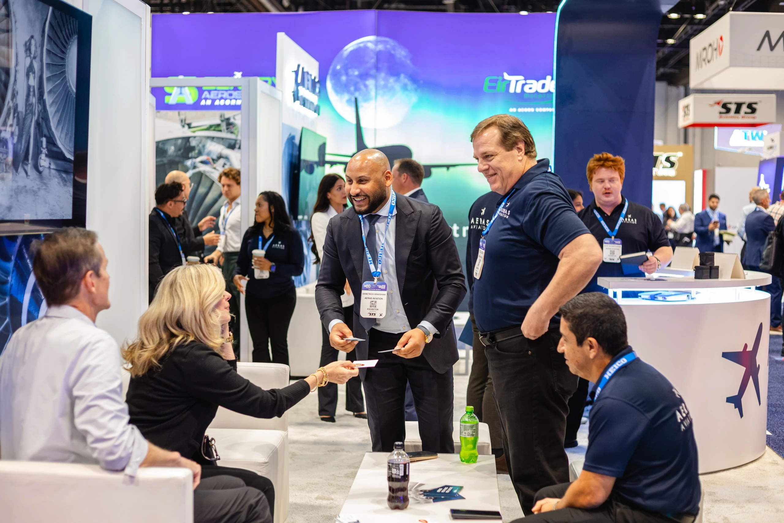 CEO networking with clients at Aeras Aviation booth
