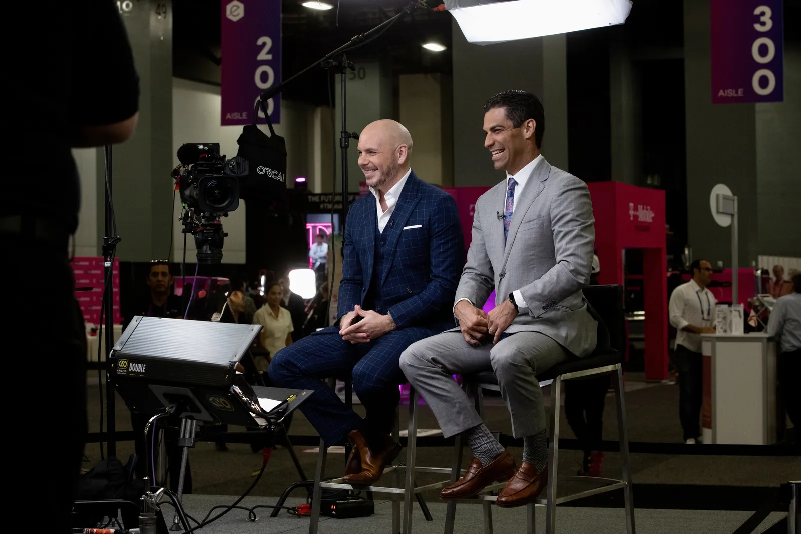 Pitbull and Mayor Francis Suarez on a Bonomotion interview set at a convention